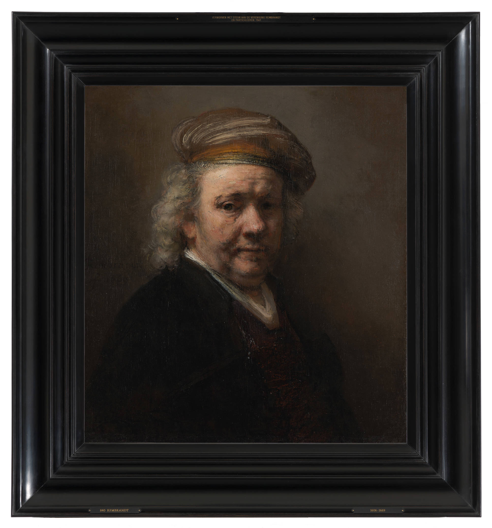 Ingelijst schilderij van Rembrandt van Rijn. Je ziet een Zelfportret in een zwarte lijst. Framed painting by Rembrandt van Rijn. You see his Self-portrait in a black frame.