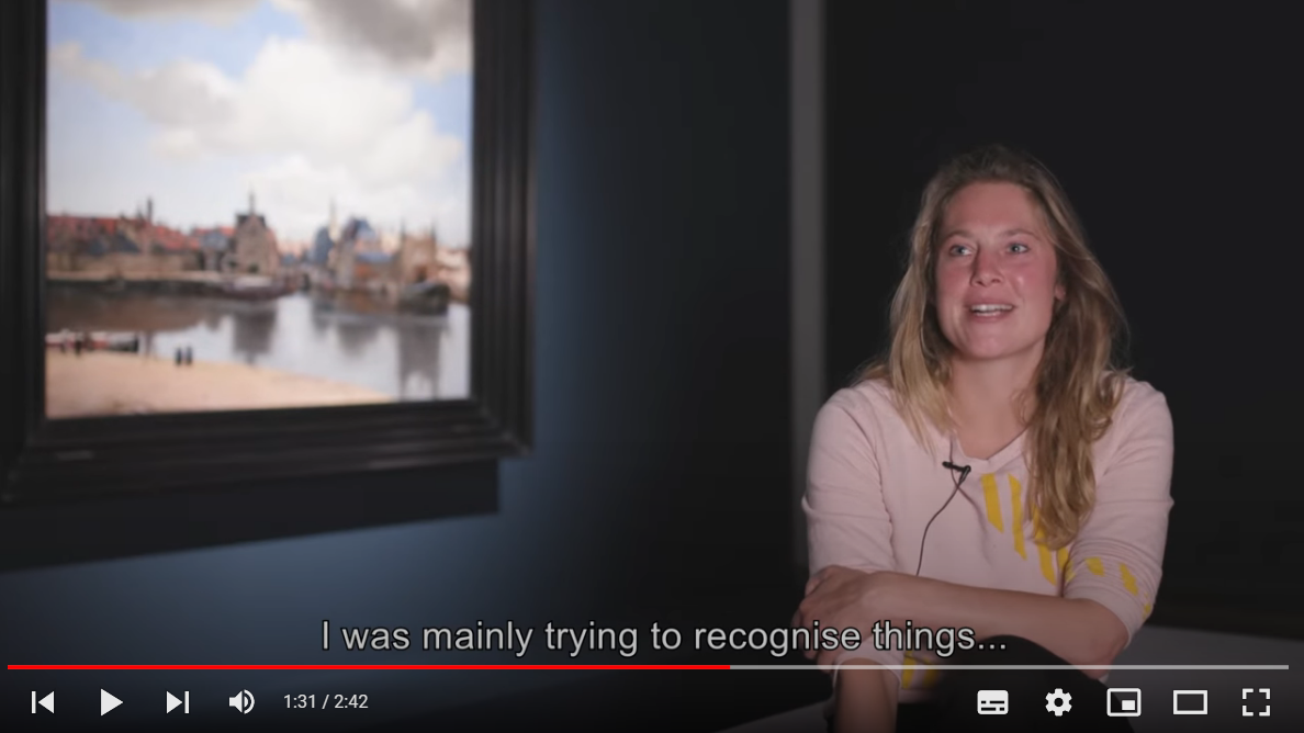 Een Youtube-still van een interview met een bezoeker die Gezicht op Delft heeft bekeken.