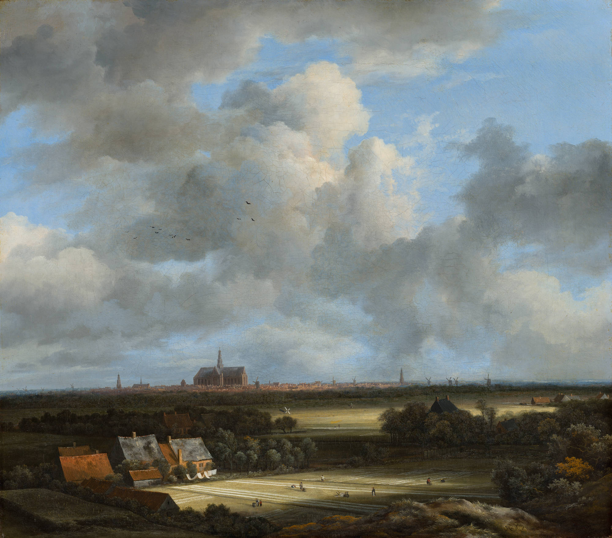 Schilderij van Jacob van Ruisdael. Gezicht op Haarlem met bleekvelden. View of Haarlem with Bleaching Grounds. Je ziet het uitzicht op Haarlem met bleekvelden op de voorgrond.